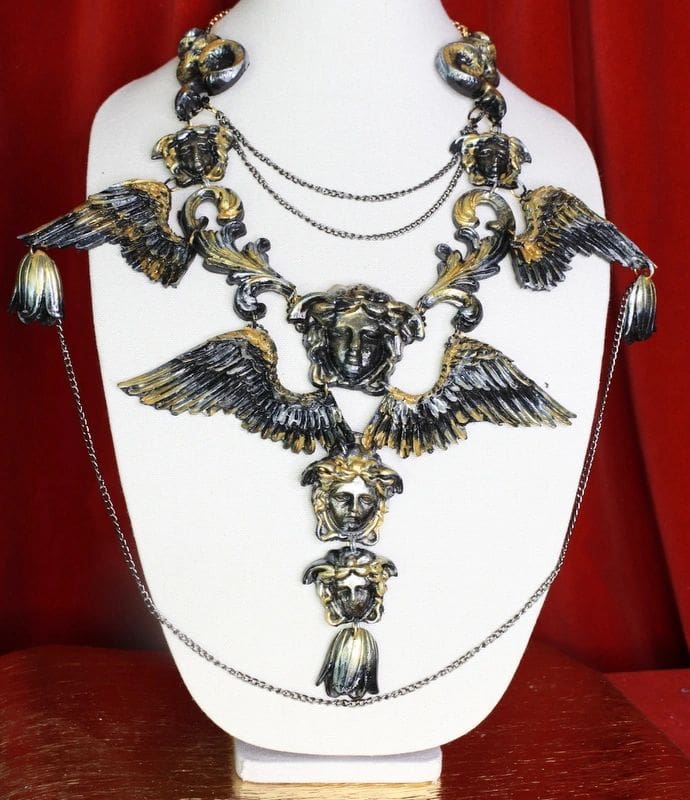 A necklace with many different designs on it