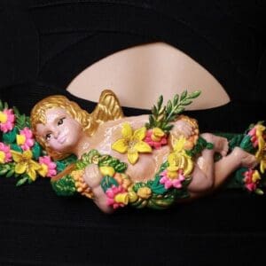 A baby angel with flowers on it's back.