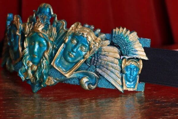 A group of blue and gold statues sitting on top of a table.