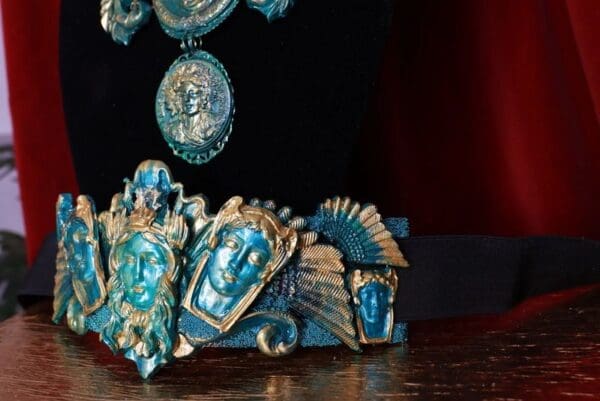 A blue statue of an indian deity on top of a table.