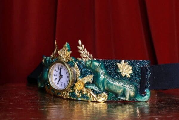 A clock is sitting on top of the table.