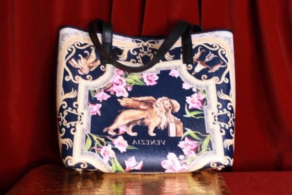 A bag with a picture of a dog and flowers.