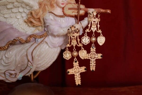 A close up of some earrings hanging from a string