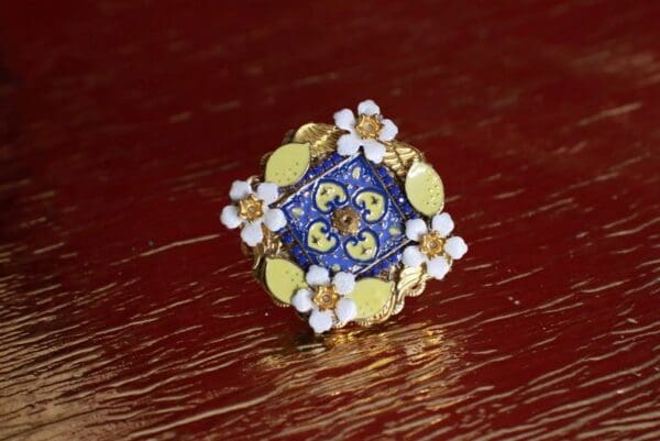 A blue and yellow ring on top of a table.