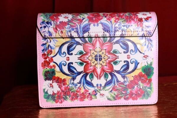 A close up of the front cover of a purse