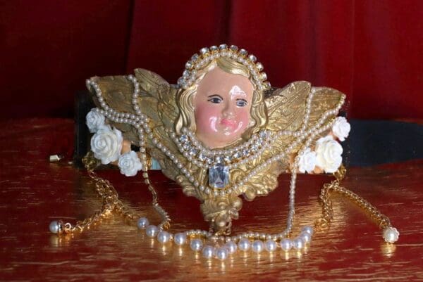 A doll head sitting on top of a table.