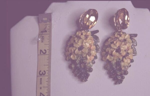 A pair of earrings that are on the floor.