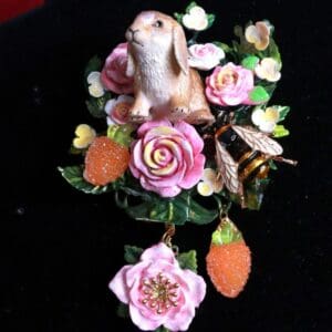 A rabbit sitting on top of some flowers.