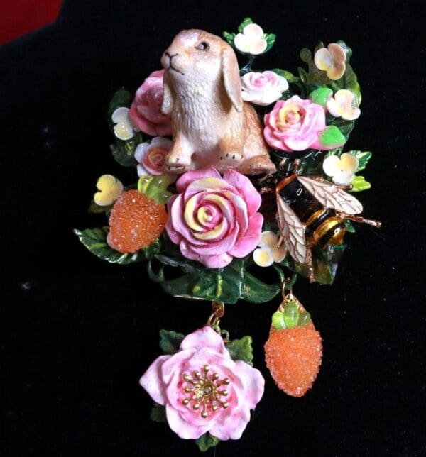 A rabbit sitting on top of some flowers.