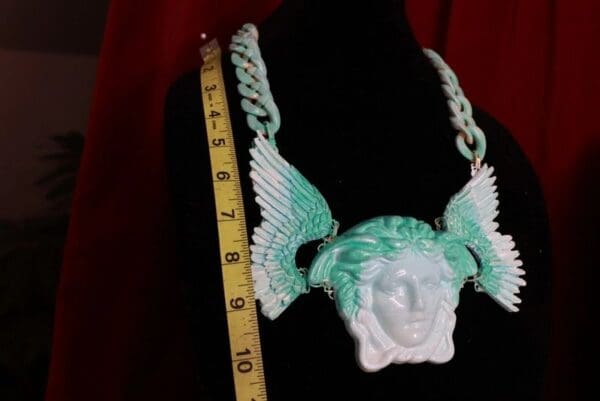 A statue of an angel with wings on it.