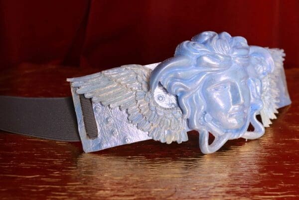 A close up of a belt buckle on the table