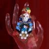 A hand with a skull and flowers on it