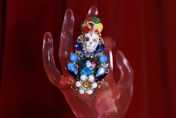 A hand with a skull and flowers on it