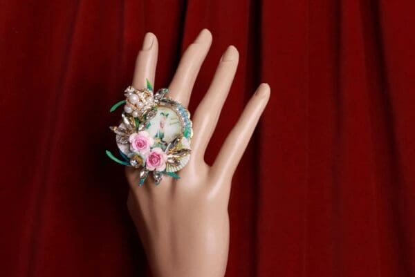 A hand with a ring on it's finger