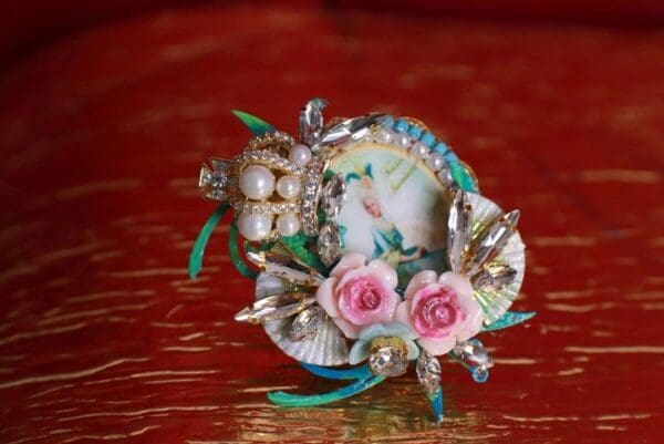 A small bowl with some flowers on top of it