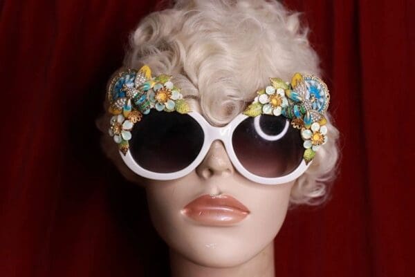 A mannequin wearing sunglasses with flowers on them.