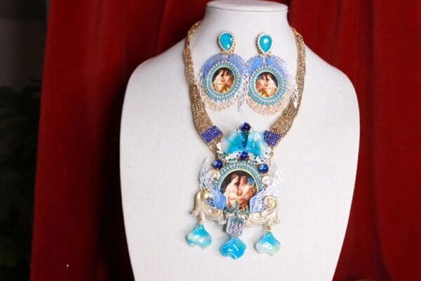 A necklace and earrings set with blue stones.