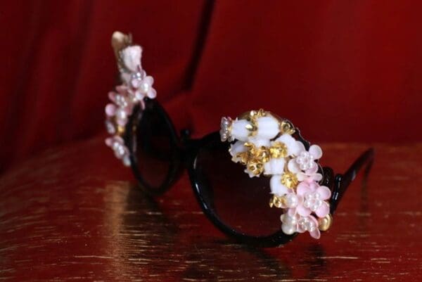 A pair of sunglasses with flowers on them.