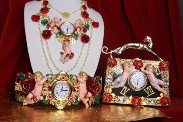 A table with three different clocks and jewelry.