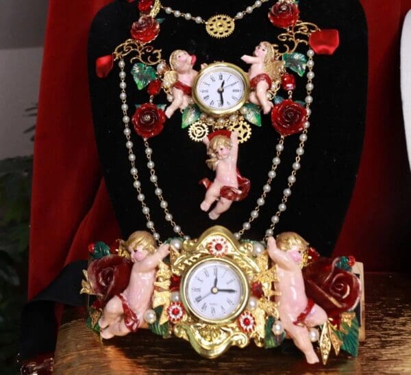 A clock and necklace on display in front of a black background.