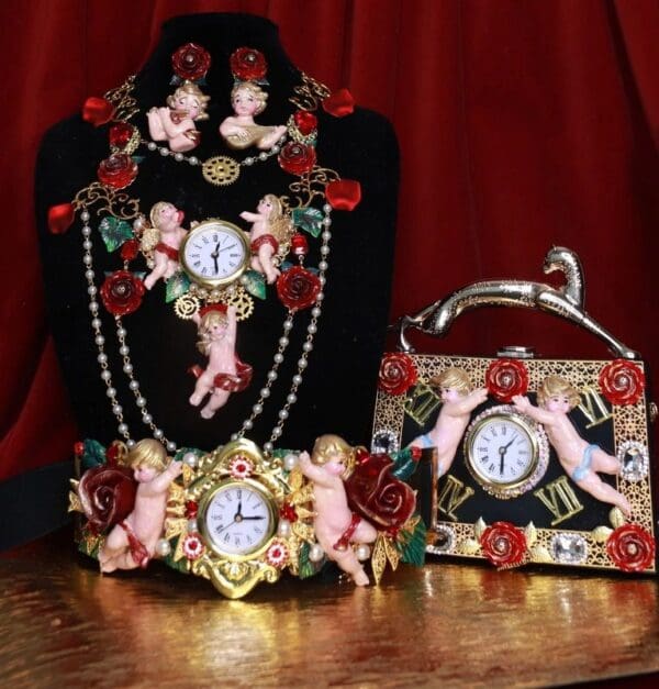A table with three different jewelry and a clock.