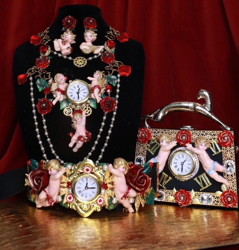 A table with three different jewelry and a clock.