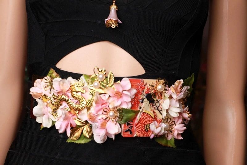 A black purse with flowers on it