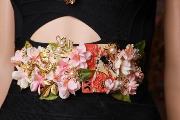 A close up of the back of a purse with flowers