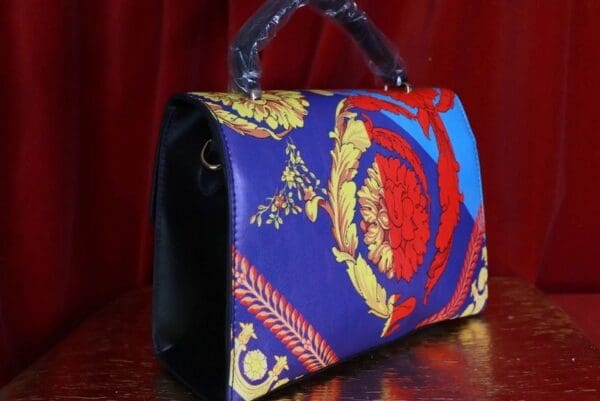 A purse that is sitting on top of a table.