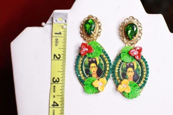 A pair of earrings with a picture on them