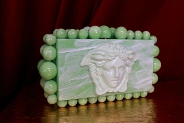 A green and white box with a face on it