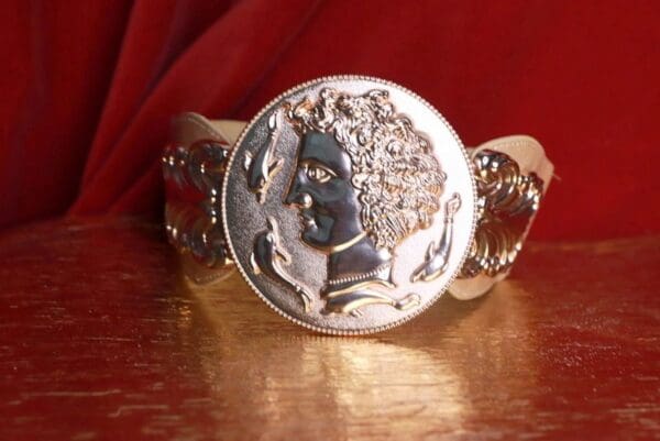 A silver coin is sitting on top of a table.