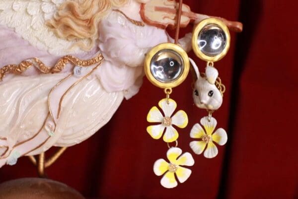 A pair of earrings hanging from the ceiling.