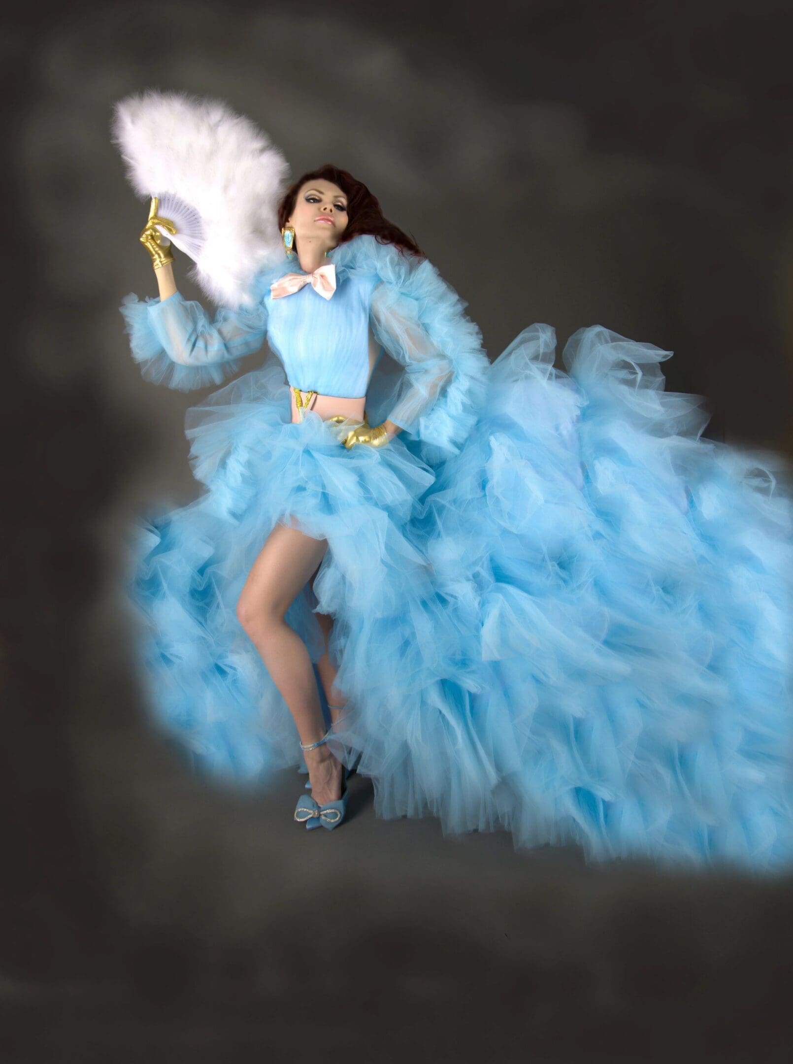 A woman in blue dress and high heels.