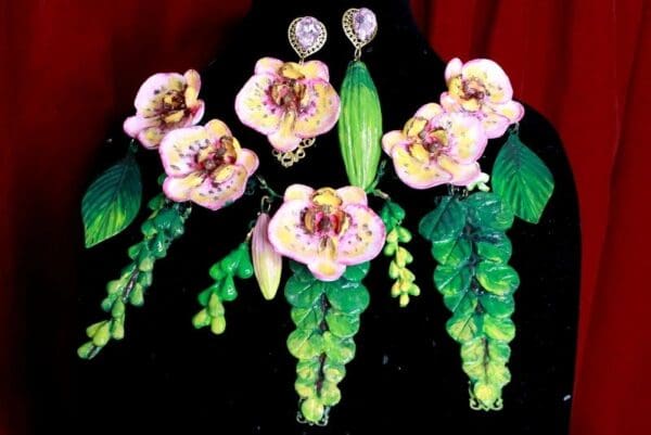 A close up of some earrings with flowers