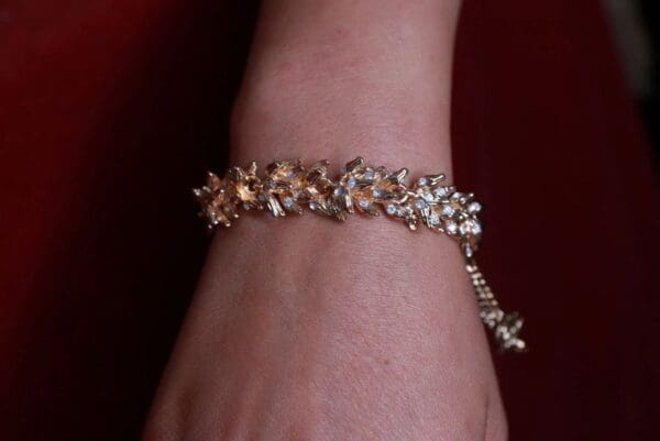 A woman 's wrist with a bracelet on it