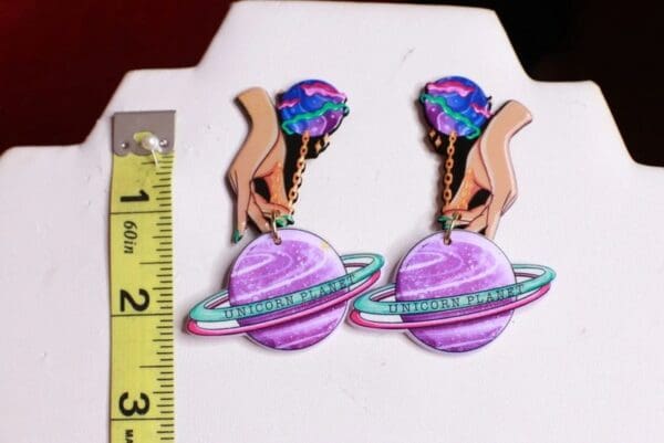 A pair of earrings that are on display.