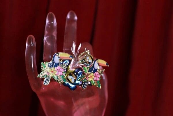 A hand with some kind of jewelry on it