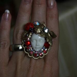 A woman 's hand with a ring on it
