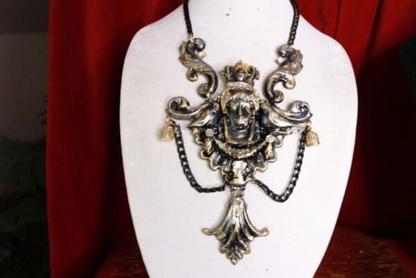 A necklace with a face on it