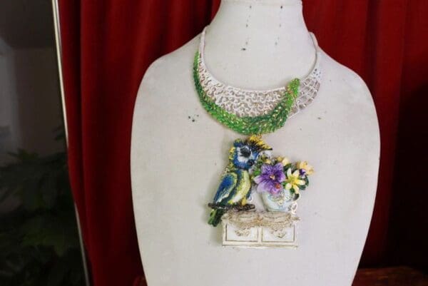 A necklace with two birds on it