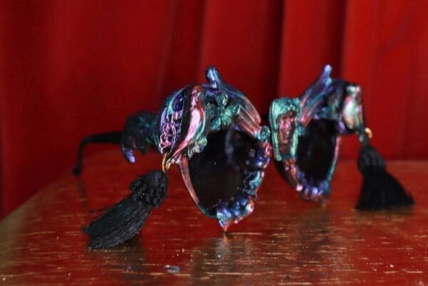 A pair of glasses sitting on top of a table.