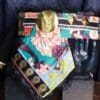 A close up of a bag with a mask on it