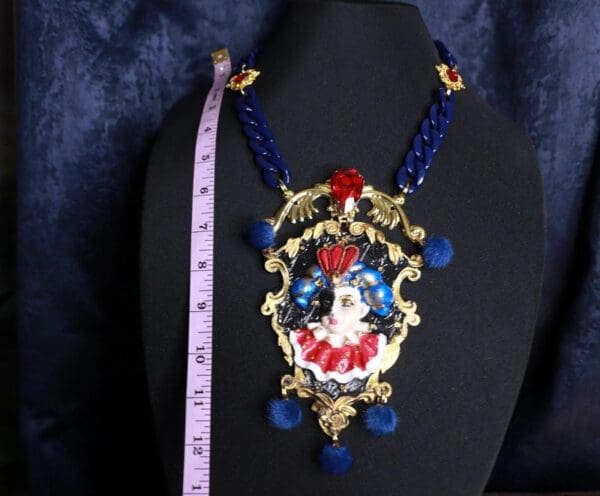 A necklace with a picture of a clown on it.