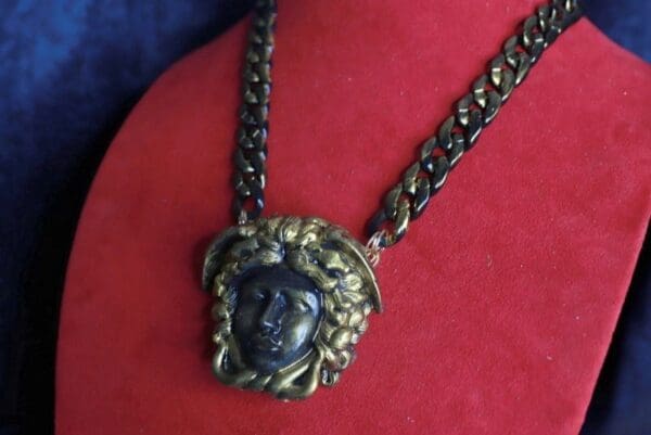 A necklace with a face on it