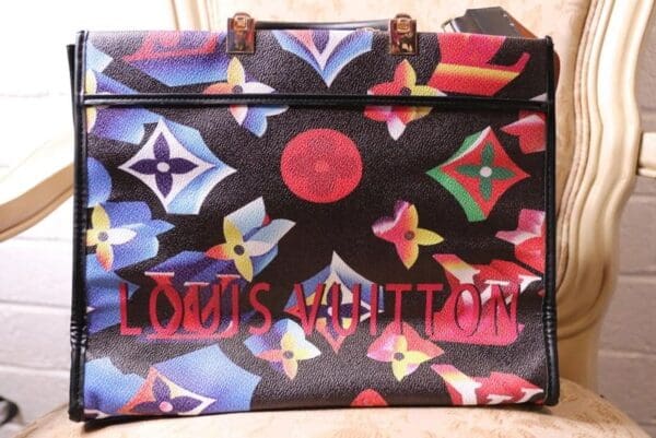 A louis vuitton bag with the name of louis vuitton on it.