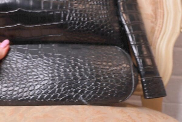 A close up of some black leather bags
