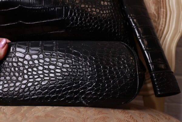 A close up of some black bags on the floor