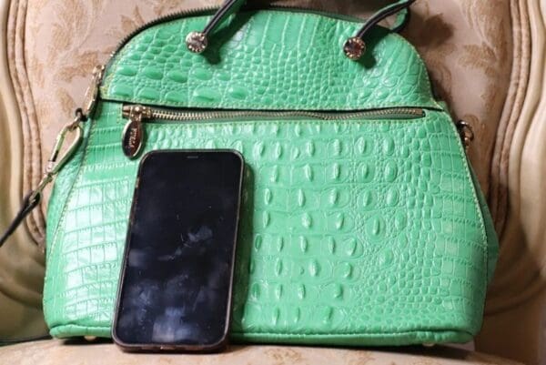 A purse with a cell phone in it