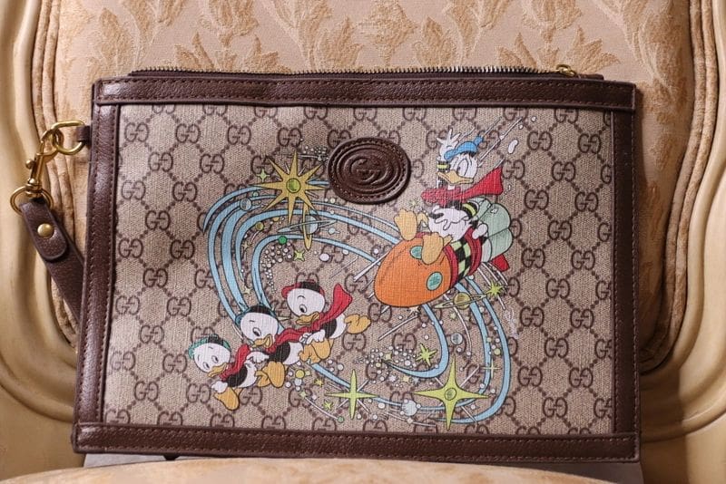 A close up of a bag with disney characters on it
